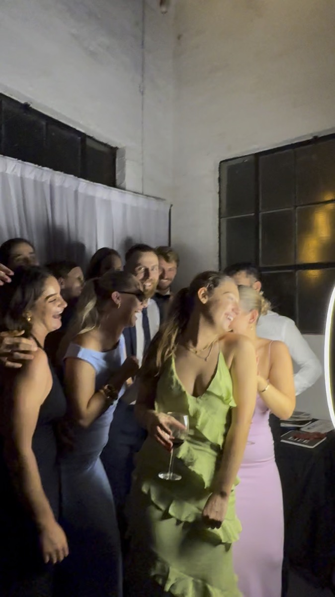 Guests having fun at a party photo booth in Perth